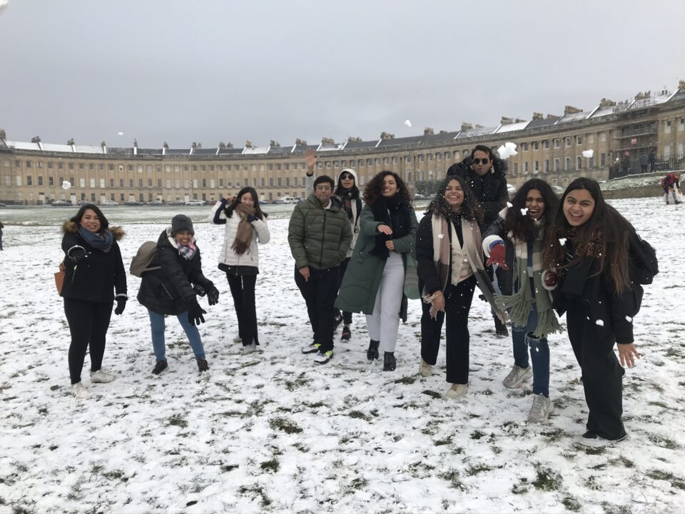 group throwing snowballs in Bath city centre.