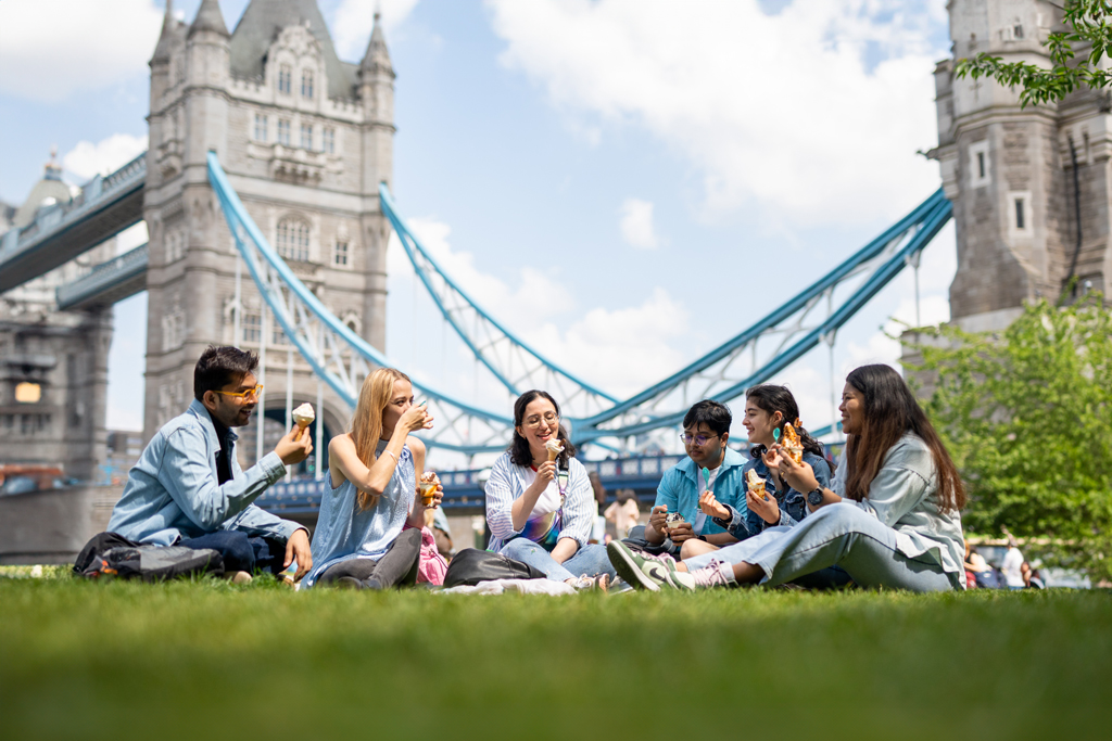 A group of people sitting on the floor 