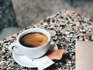 A white cup filled with americano coffee