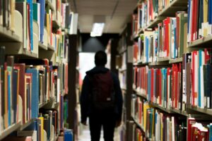 A student in the library by themselves