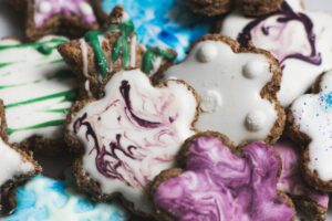 A picture of chocolate biscuits with colourful icing on it