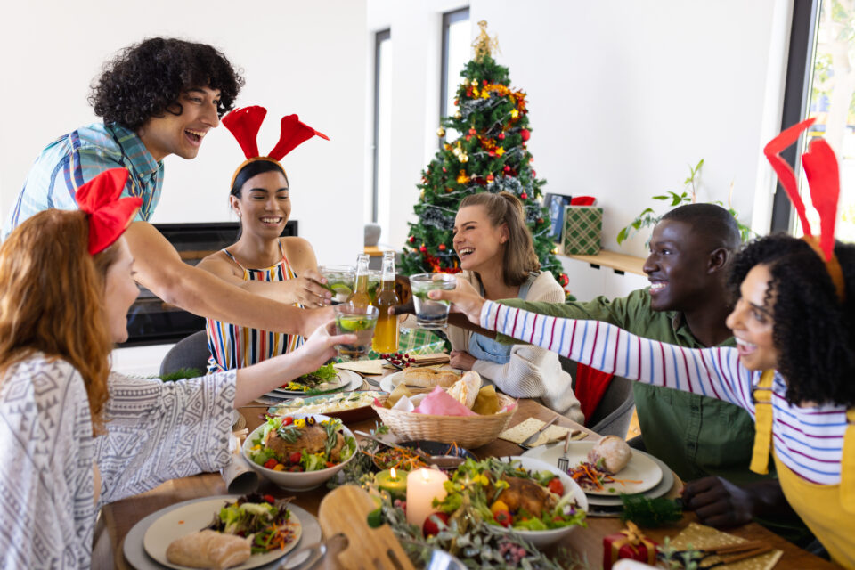 friends smiling at Christmas dinner