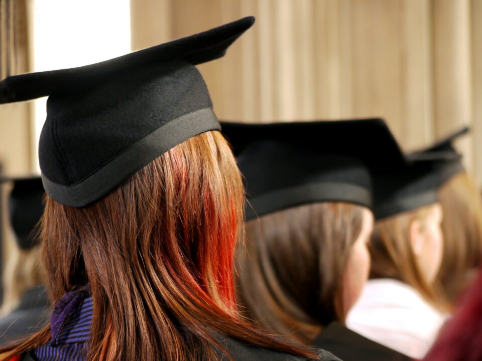 A person wearing a graduation hat