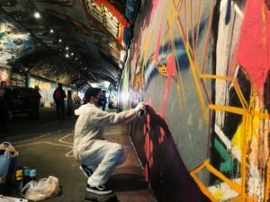 A person doing graffiti