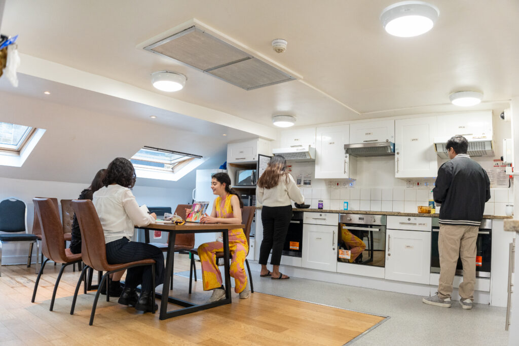 A group of student sin the kitchen 