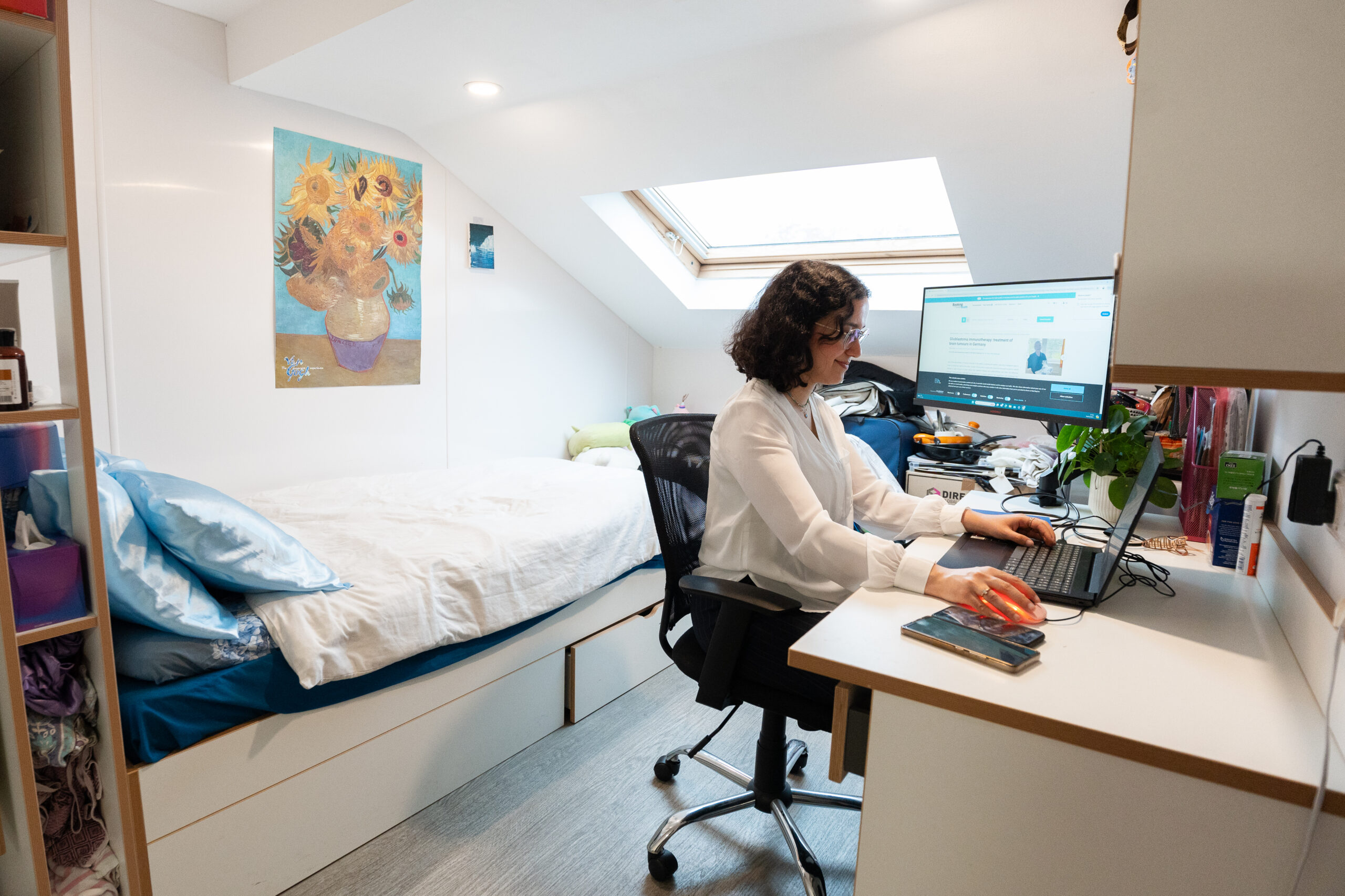 A girl sitting at her desk