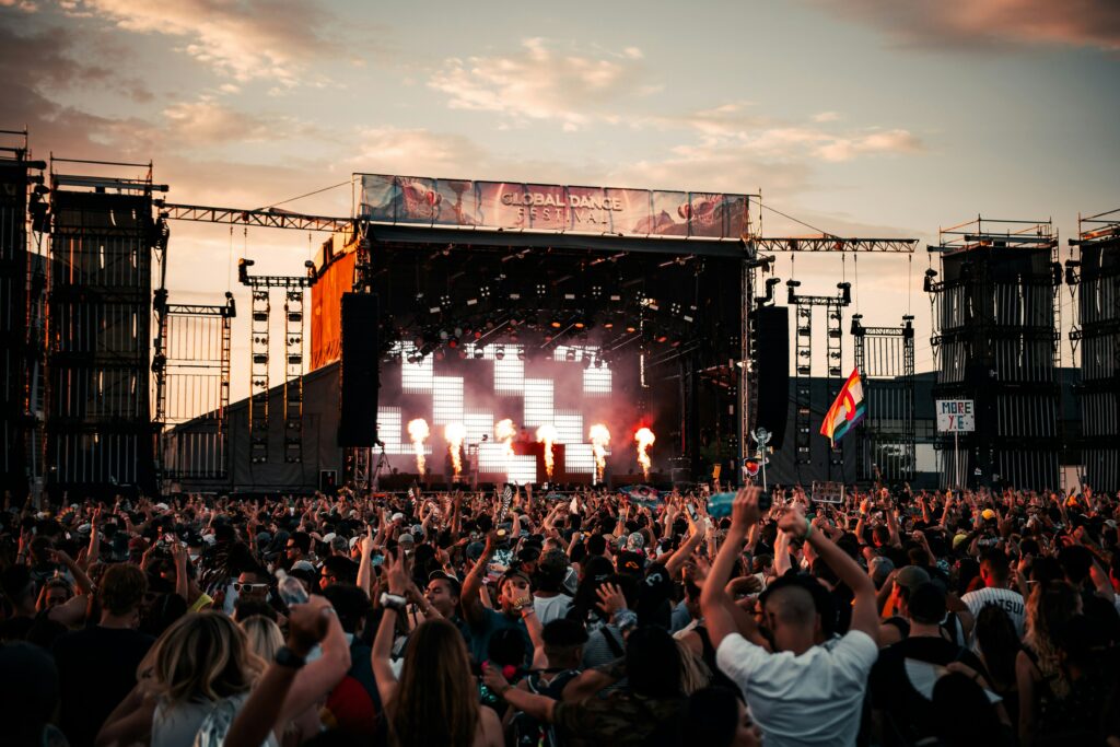 A crowd cheering on someone on stage 