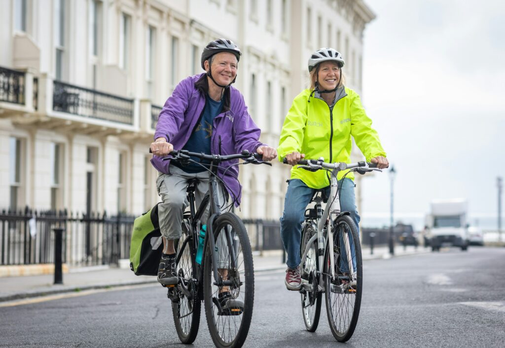 Two women riding bikes 