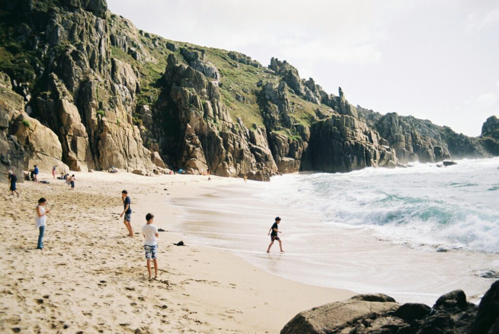 Kids playing on the beach.