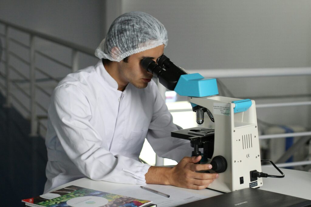 A man looking through a microscope