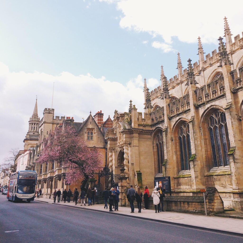 People walking next to a cathedral in Oxford