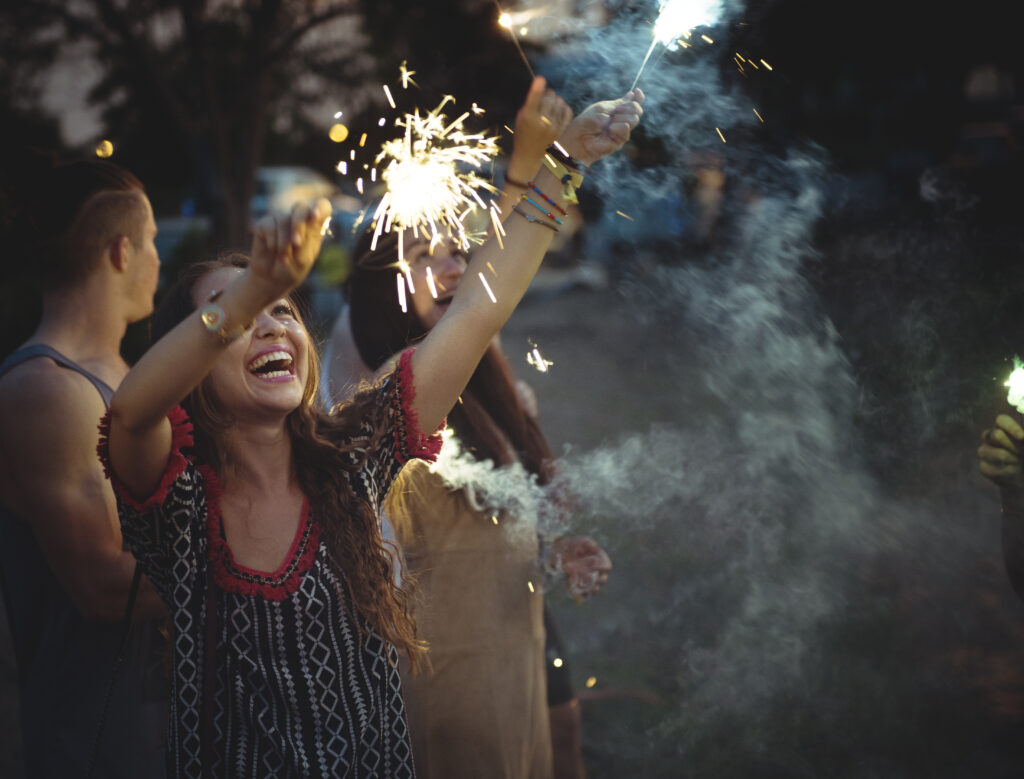 Woman Enjoying Sparkler in Festival Event