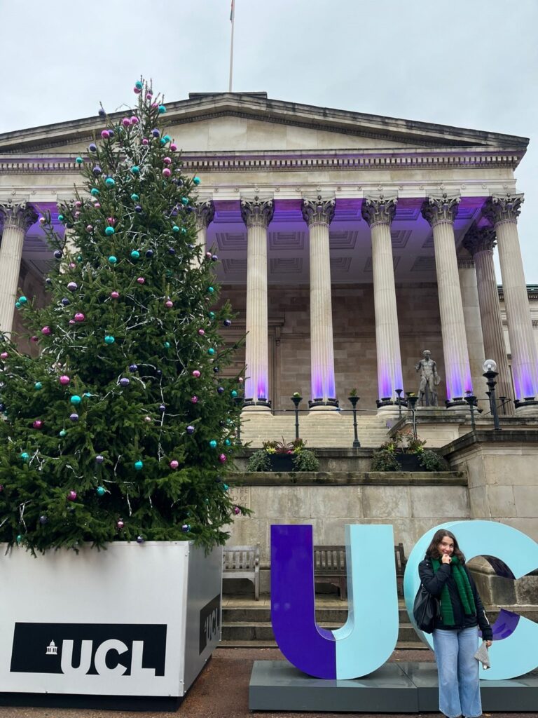 Women standing in front of Christmas tree