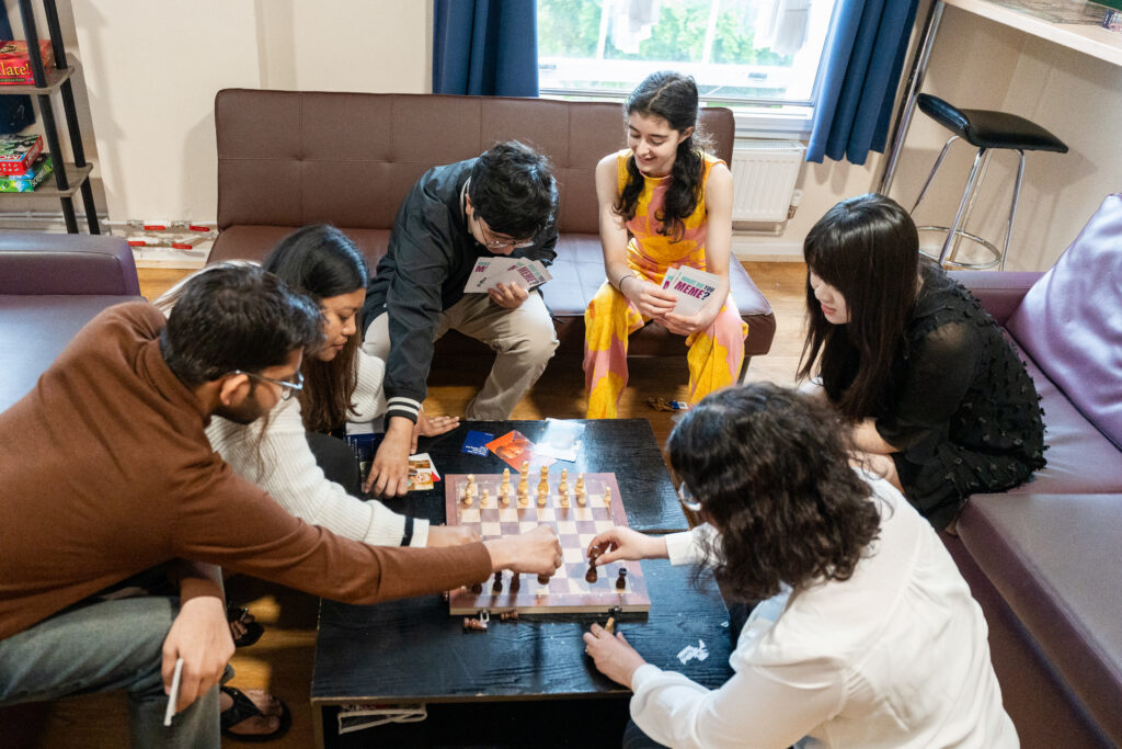 friends playing chess together