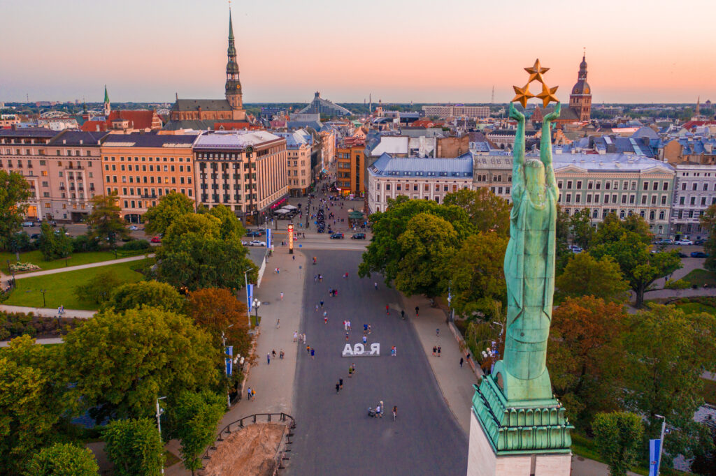 An amazing Aerial View of the Statue of Liberty Milda in Riga, Latvia during sunset